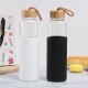 New single-wall glass, bamboo lid with handle, outdoor portable, silicone sleeve, glass water bottle, wholesale.
