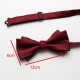 Solid-color men's polyester bow ties in stock, including multi-colored wedding groom and groomsmen bow ties and tie ties.
